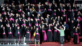 Bishops participate in a musical number on stage before Pope Francis arrives for mass in an all-night vigil for those attending World Youth Day, in Rio de Janeiro